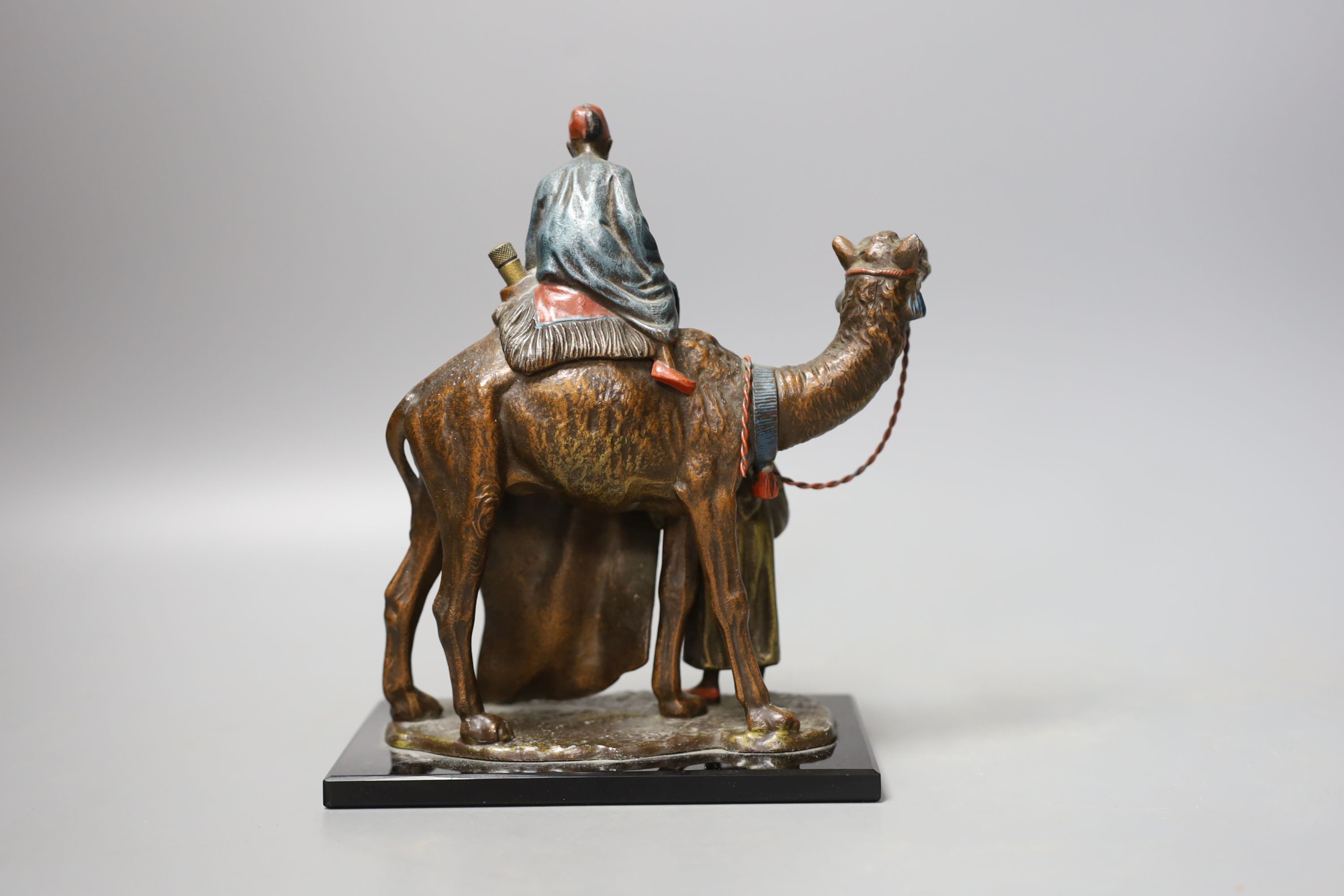 A cold painted metal ‘rug sellers and camel’ table lighter in Bergman style 19cm